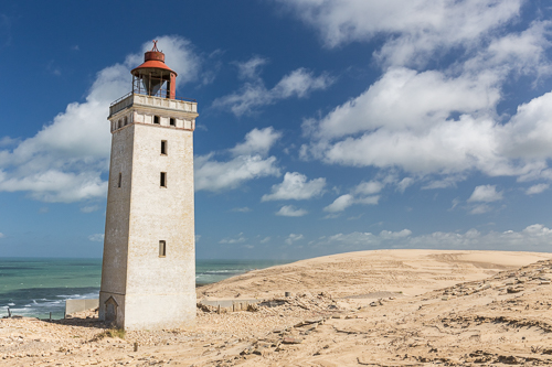 Rubjerg Knude Lighthouse at the edge of the cliff...