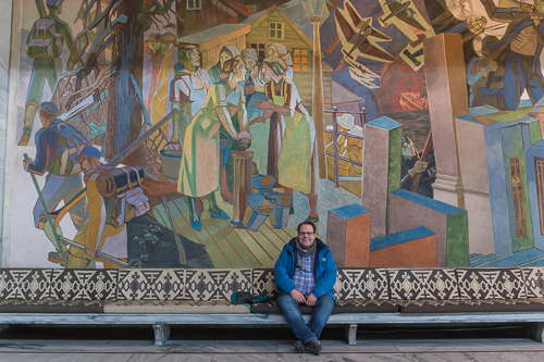 Michiel in front of one of the many murals inside Oslo city hall