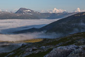 View towards Tromsdalstinden, fog in the foreground and in the far background you can see the afternoon showers forecasted further inland