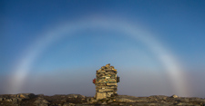 A magical moment when the clouds disappeared just when I reached the top, and a strong fogbow appeared