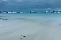 One of the white beaches at Sommarøy, under a very dark sky
