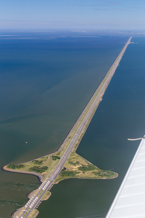 De Afsluitdijk, a 32 km long dike that closes off the IJsselmeer (now a lake, previously sea)