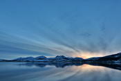 Beautiful sky reflected in the calm fjord