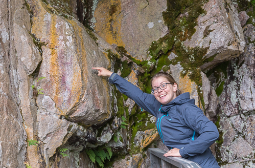 Teresa pointing out the nearly-impossible-to-spot rock painting - even with some cheating in photoshop it's hard to see!