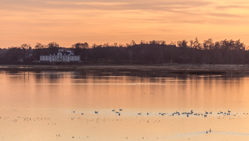 Sunset view over the lake, with Castle Dagsnäs in the background