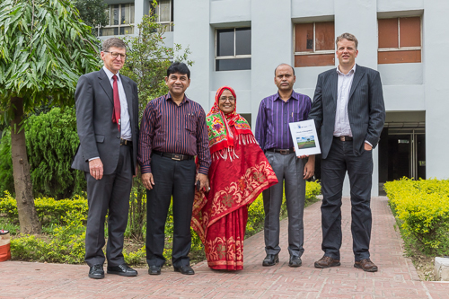 Group photo presenting the climate report, written by three people on the right: Ayesha, Bazlur and Hans Olav