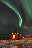 A curtain of northern lights above the hut