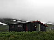 The hut surrounded by low clouds