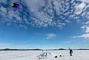 Paul flew his kite for a bit. This is on lake Inari, a really large lake. The crater next to Paul is where the ice is pushed up on a boulder